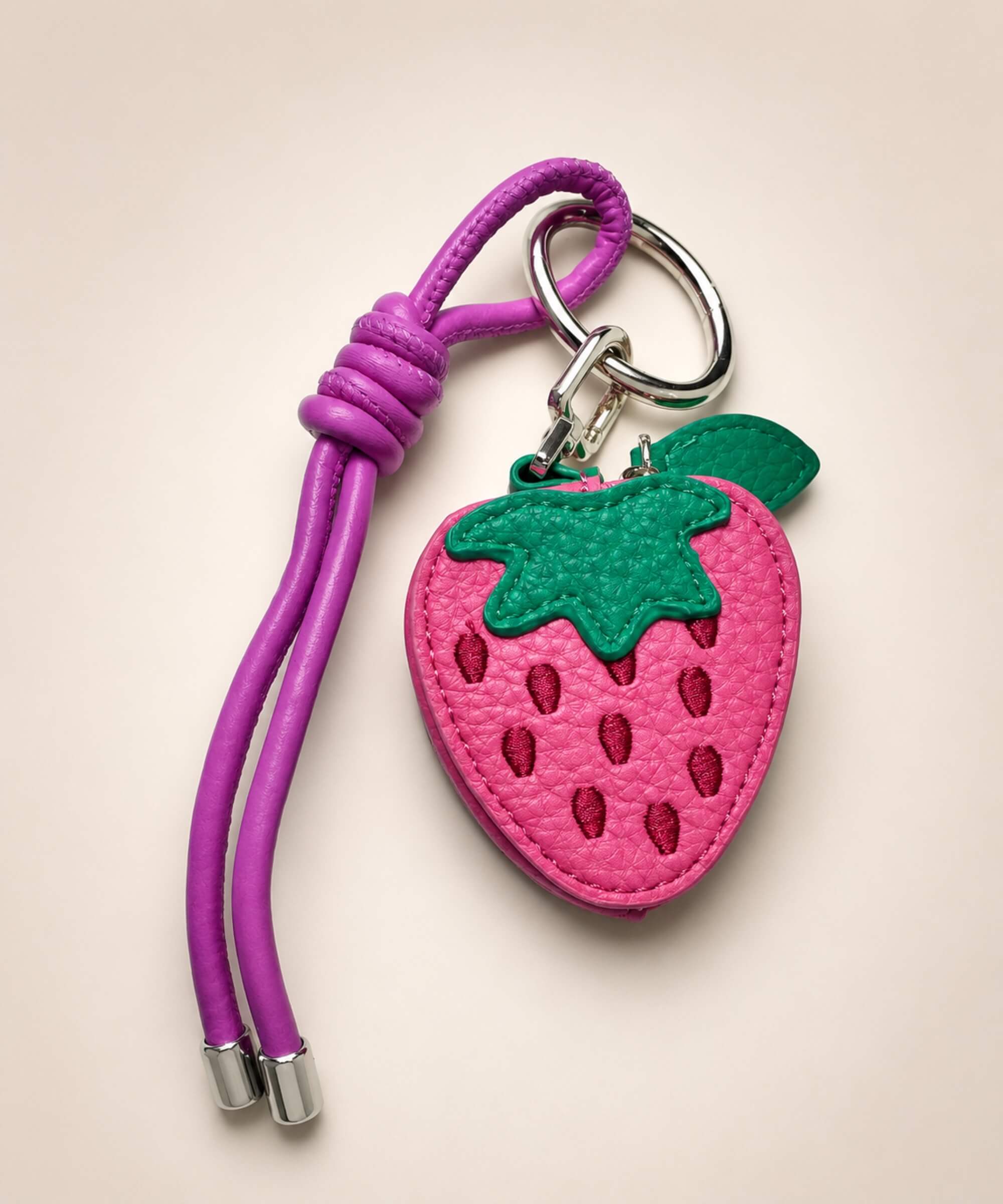 Strawberry fruit coin purse keychain with pink PU leather-style pouch, green leaf detail and matching strap
